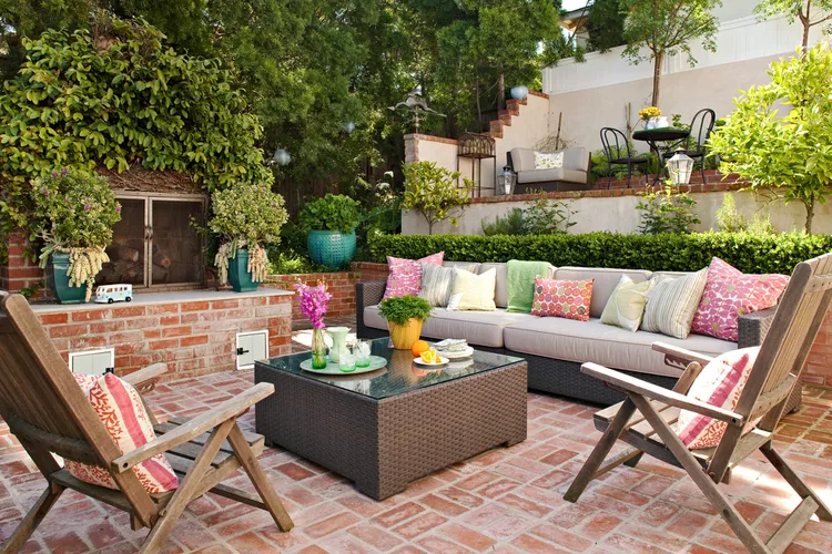 brick-patio-various-colored-throw-pillows-