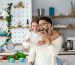 portrait-of-happy-young-couple-cooking-together-in-the-kitchen-at-home-cute-young-couple-enjoying-their-breakfast-together-she-is-pouring-him-milk-photo